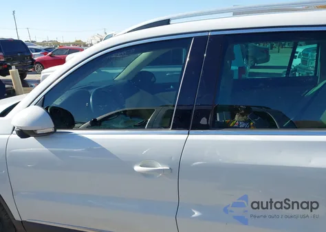 2014 Volkswagen Tiguan Sel z USA, uszkodzony, nr VIN WVGAV3AX2EW557592